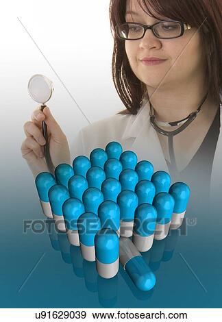 Stock Photo - Female doctor looking at virtual capsules.. Fotosearch