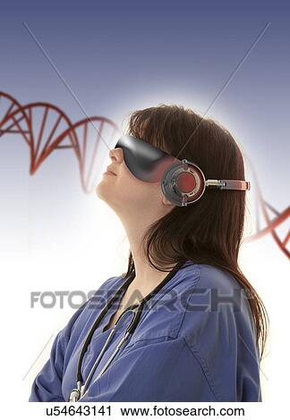 Stock Image - Female doctor wearing virtual reality headset and examining DNA (deoxyribonucleic acid) strand.. Fotosearch