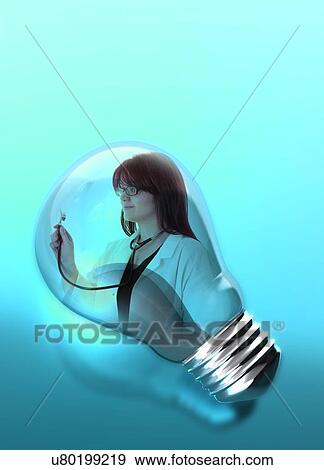 Stock Photo - Female doctor with stethoscope in lightbulb.. Fotosearch