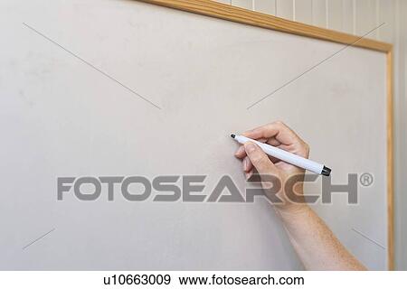 Stock Photo - Female hand writing on whiteboard.. Fotosearch