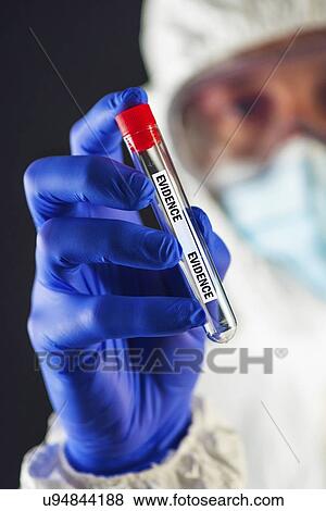 Forensic scientist with evidence tube. View Large Photo Image Stock Photo - Forensic scientist with evidence tube.. Fotosearch