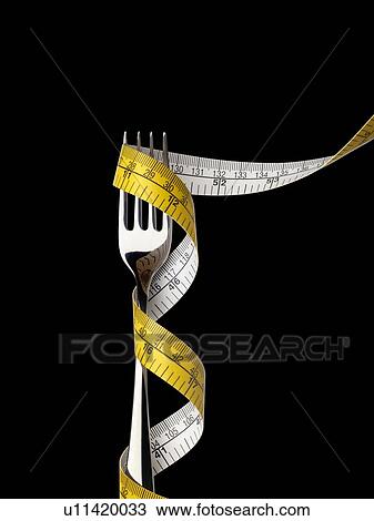 Stock Image - Fork with tape measure.. Fotosearch