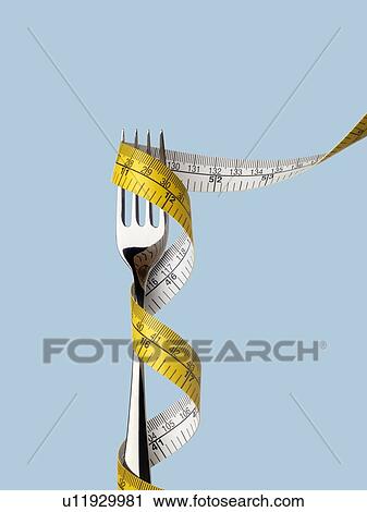 Fork with tape measure. View Large Photo Image Stock Image - Fork with tape measure.. Fotosearch