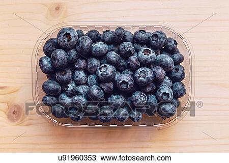 Fresh blueberries in plastic container box, top view. View Large Photo Image Stock Image - Fresh blueberries in plastic container box, top view.. Fotosearch