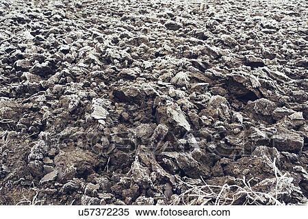 Frozen plowed agricultural field covered with frost. View Large Photo Image Stock Photography - Frozen plowed agricultural field covered with frost.. Fotosearch