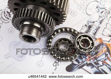 Gears, cogs and ball-bearings set against a blueprint. c View Large Photo Image Stock Image - Gears, cogs and ball-bearings set against a blueprint. c. Fotosearch