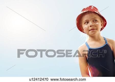 Girl wearing sunhat and suncream, portrait. View Large Photo Image Stock Image - Girl wearing sunhat and suncream, portrait.. Fotosearch