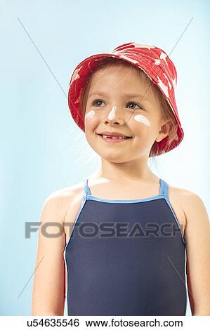 Girl wearing sunhat and suncream, portrait. View Large Photo Image Stock Photograph - Girl wearing sunhat and suncream, portrait.. Fotosearch
