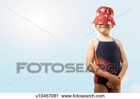 Girl with sunhat covering face, smiling. View Large Photo Image Stock Image - Girl with sunhat covering face, smiling.. Fotosearch