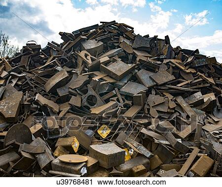 Stock Image - Heap of steel scrap in scrapworks in the West Midlands, UK.. Fotosearch