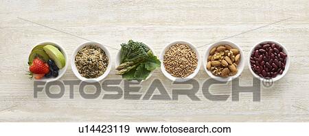 Stock Photo - High fibre foods in bowls, still life.. Fotosearch