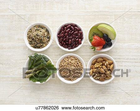 Stock Photograph - High fibre foods in bowls, still life.. Fotosearch