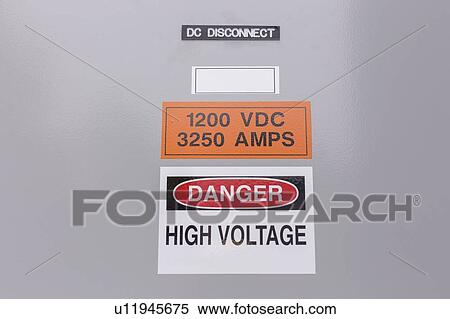 Stock Photography - High voltage sign on DC Disconnect panel.. Fotosearch