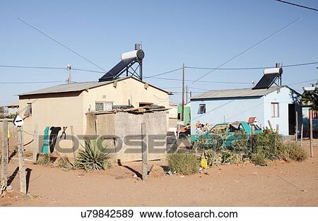 Stock Photo - House on an informal settlement (township) with a solar water heater, Vredendal, Western Cape, South Africa.. Fotosearch