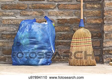 Household broom and bag of rubbish. View Large Photo Image Stock Image - Household broom and bag of rubbish.. Fotosearch