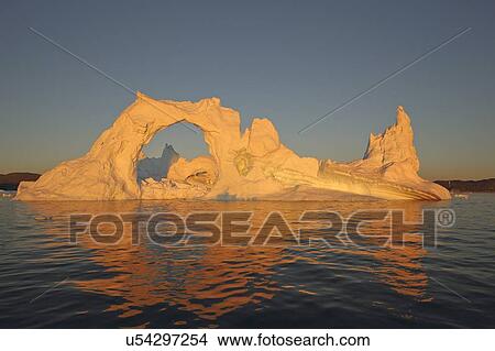 Picture - Icebergs from the icefjord, Ilulissat, Disko Bay, Greenland, at sunset.. Fotosearch
