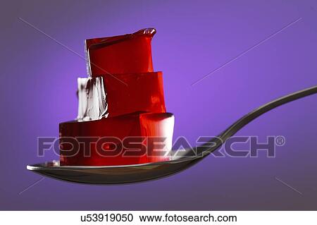 Stock Image - Jelly on a spoon.. Fotosearch