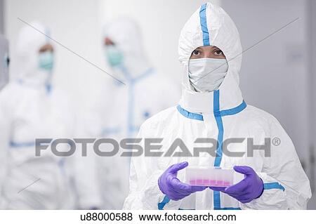 Lab technician carrying a cell-based testing kit in a laboratory that engineers human tissues for implant. Such implants include bone and skin grafts. View Large Photo Image Stock Photo - Lab technician carrying a cell-based testing kit in a laboratory that engineers human tissues for implant. Such implants include bone and skin grafts.. Fotosearch