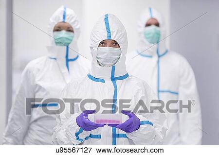 Lab technician carrying a cell-based testing kit in a laboratory that engineers human tissues for implant. Such implants include bone and skin grafts. View Large Photo Image Stock Photo - Lab technician carrying a cell-based testing kit in a laboratory that engineers human tissues for implant. Such implants include bone and skin grafts.. Fotosearch
