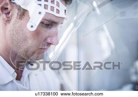 Lab technician wearing a face shield. View Large Photo Image Stock Image - Lab technician wearing a face shield.. Fotosearch