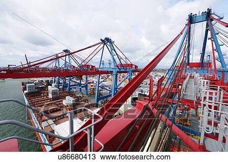 Large commercial container port and ships. View Large Photo Image Stock Image - Large commercial container port and ships.. Fotosearch