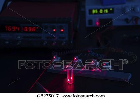 Stock Photo - Laser experiment in photonics laboratory.. Fotosearch