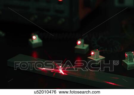 Stock Photograph - Laser experiment in photonics laboratory.. Fotosearch