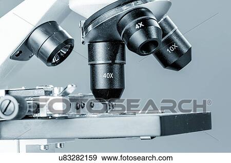 Stock Photo - Light microscope stage and lenses.. Fotosearch