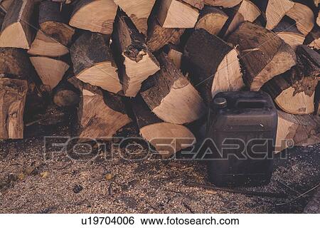 Stock Photograph - Logs and oil can.. Fotosearch