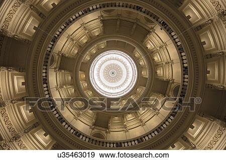 Stock Photo - Looking up inside the dome of the Texas state capitol building in Austin. Fotosearch