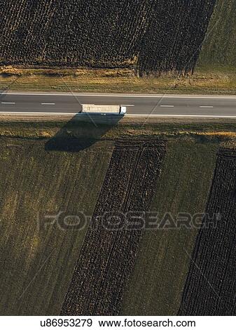 Stock Photo - Lorry on rural road, aerial view.. Fotosearch