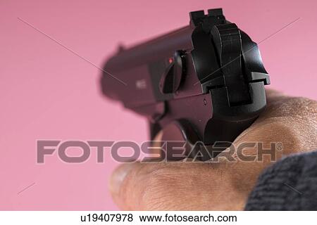 Stock Photo - Male hand aiming gun.. Fotosearch