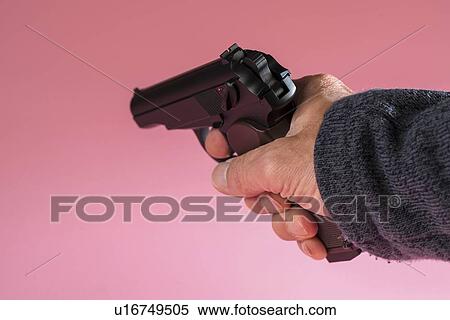 Stock Photography - Male hand aiming gun.. Fotosearch