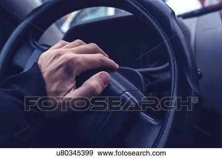 Stock Photo - Male hand honking the car horn.. Fotosearch