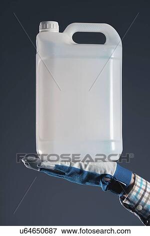 Stock Photo - Man holding plastic canister.. Fotosearch