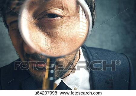 Man looking through magnifying glass. View Large Photo Image Stock Photo - Man looking through magnifying glass.. Fotosearch