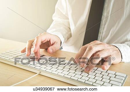 Stock Photo - Man using keyboard.. Fotosearch