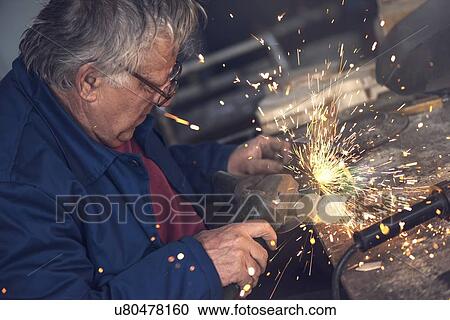 Man using metal grinder. View Large Photo Image Stock Image - Man using metal grinder.. Fotosearch