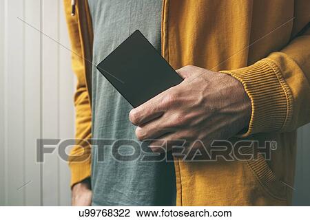 Stock Image - Man with smartphone.. Fotosearch