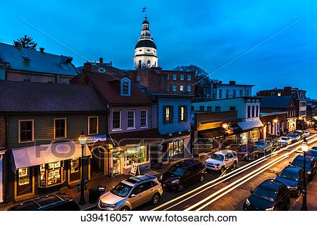 Stock Photo - Maryland State Capitol is seen at dusk above Main Street Annapolis, Maryland. Fotosearch
