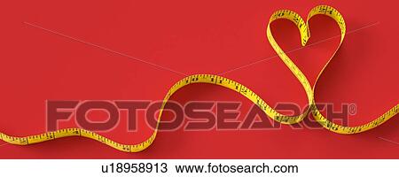 Stock Image - Measuring tape in the shape of a heart.. Fotosearch
