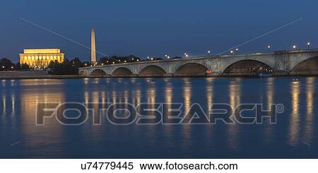 Stock Photography - Memorial Bridge at dusk blue-hour spans Potomac River and features Lincoln Memorial and Washington Monument. Fotosearch