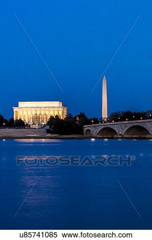 Stock Photography - Memorial Bridge at dusk blue-hour spans Potomac River and features Lincoln Memorial and Washington Monument. Fotosearch