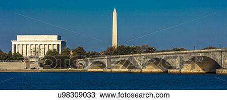 Stock Image - Memorial Bridge spans Potomac River and features Lincoln Memorial and Washington Monument. Fotosearch
