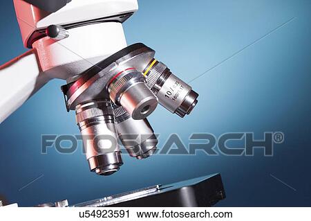 Stock Image - Microscope stage and lenses.. Fotosearch