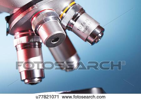 Stock Image - Microscope stage and lenses.. Fotosearch