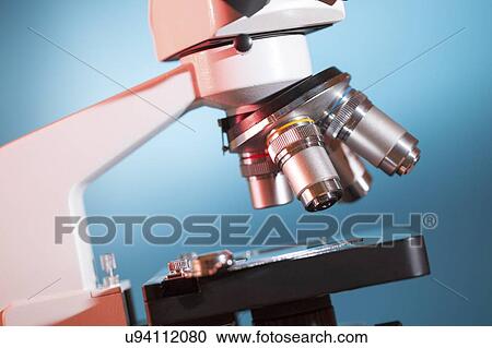 Stock Image - Microscope stage and lenses.. Fotosearch