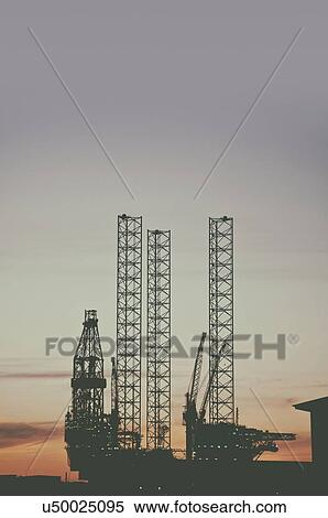 Stock Photography - Offshore oil rig at sunset, Esbjerg, Denmark.. Fotosearch