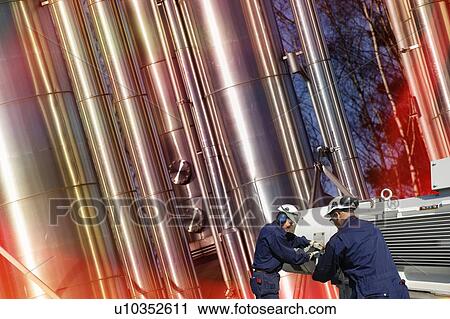 Stock Image - Oil and gas industry workers.. Fotosearch