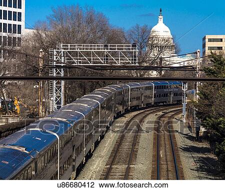 Passenger train with US Capitol in background approaches L'enfant Plaza Station, Washington D. C. View Large Photo Image Stock Image - Passenger train with US Capitol in background approaches L'enfant Plaza Station, Washington D. C.. Fotosearch